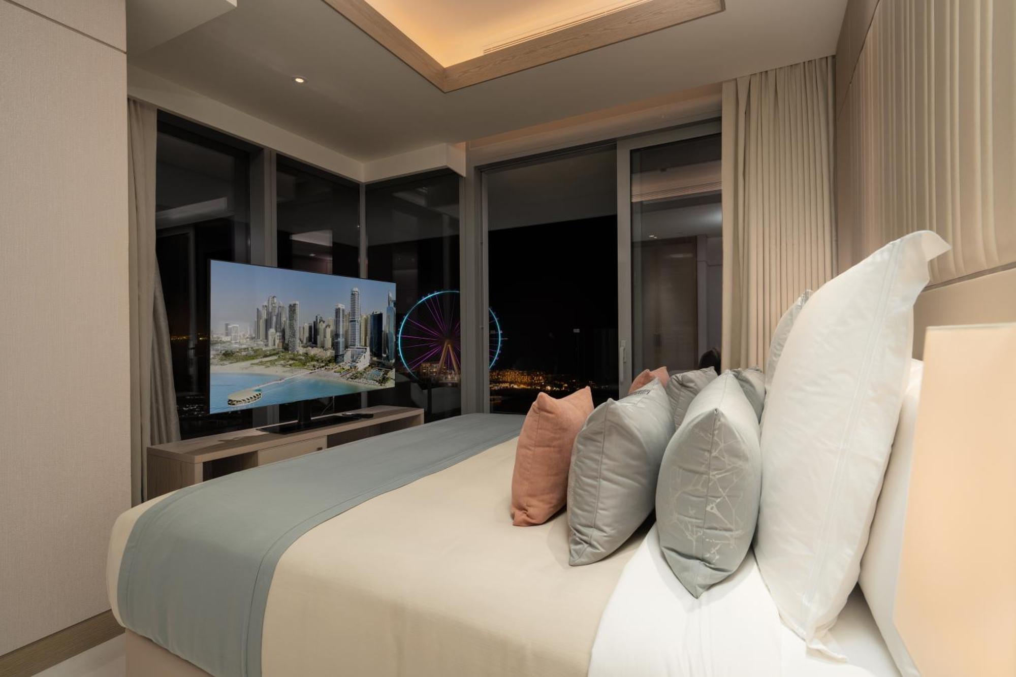 Five Luxe Dubai Exterior foto A bedroom at the Ritz-Carlton, DIFC